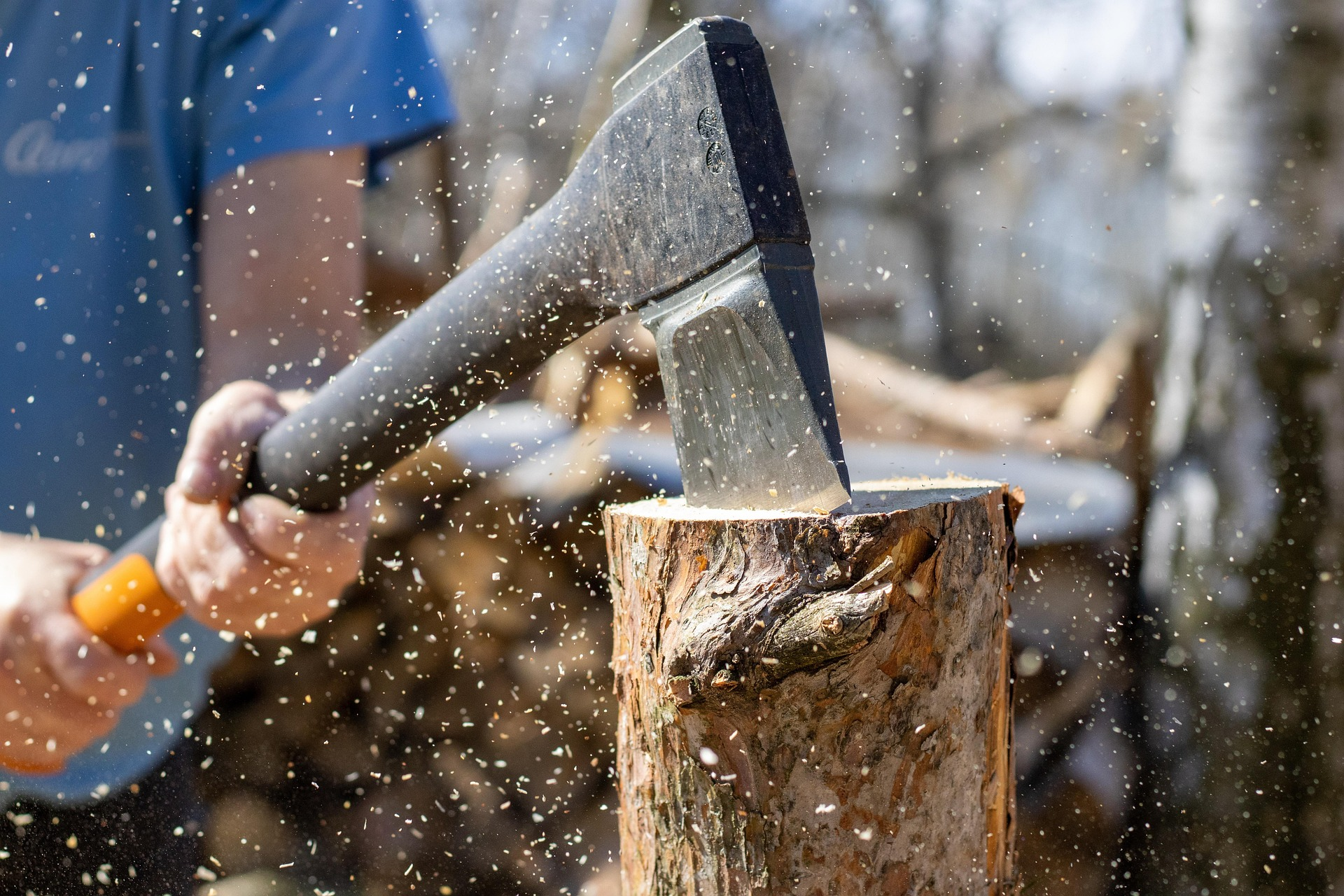An axe splitting wood